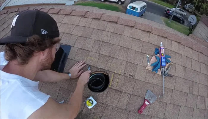 Remove any roofing nails interfering with the vent installation.
