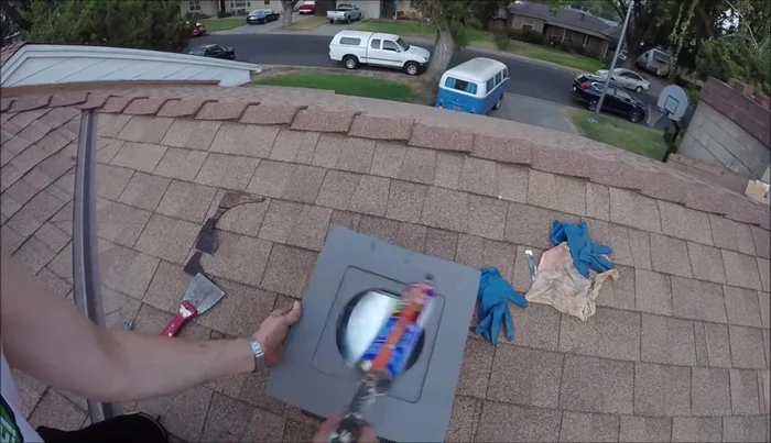 Apply more sealant over the nail heads and along the top and sides of the vent to ensure a watertight seal.