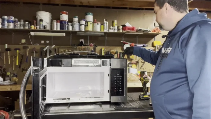 Remove the keypad. This usually involves removing one screw located beneath the keypad.