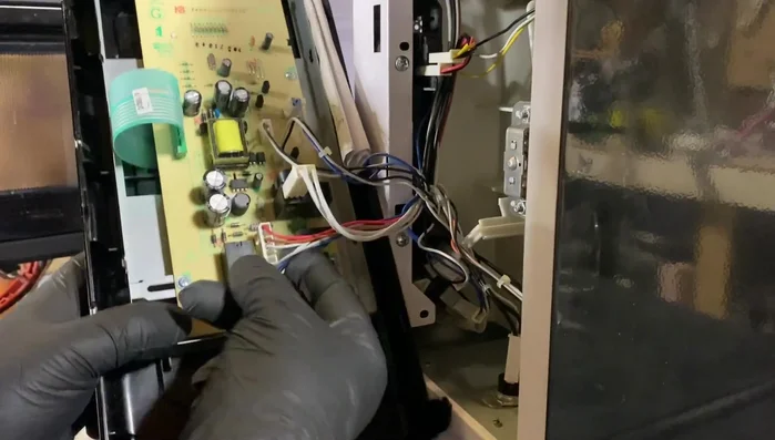 Disconnect the wires from the microswitches carefully.