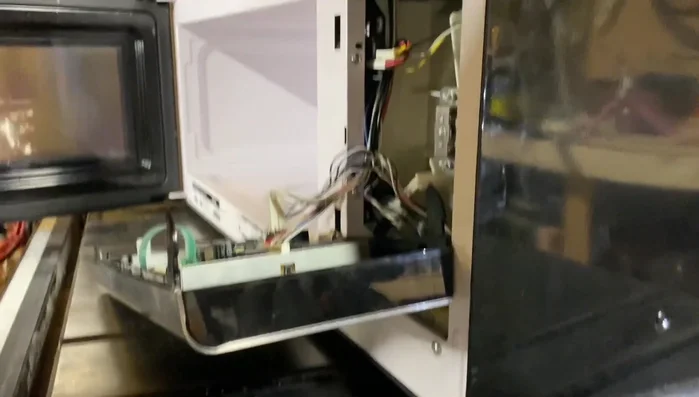 Reassemble the microwave in reverse order of disassembly. Be mindful of the tabs and screws.