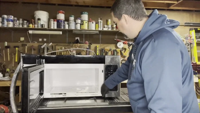 Remove the keypad. This usually involves removing one screw located beneath the keypad.