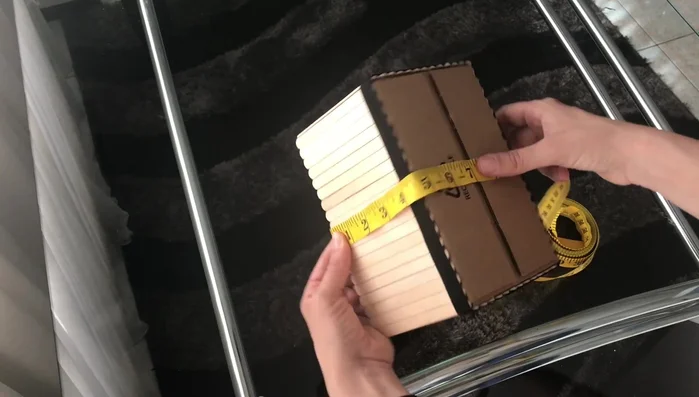 Glue the short sides of the fabric together to form a box shape.