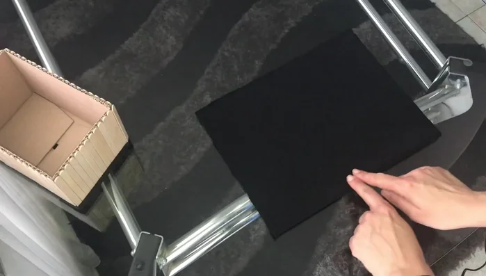 Glue the short sides of the fabric together to form a box shape.