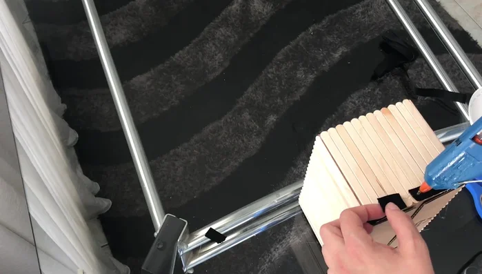 Glue the ribbon around the bottom edge of the box.