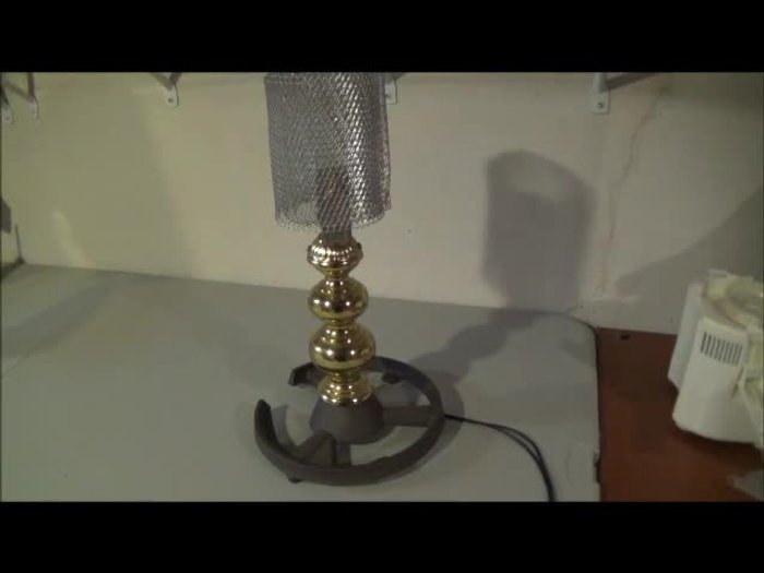 Gather recycled materials: a television cord, old floor lamp base, chandelier parts (base and possibly a handle/stick), shelf brackets, and a gutter guard.