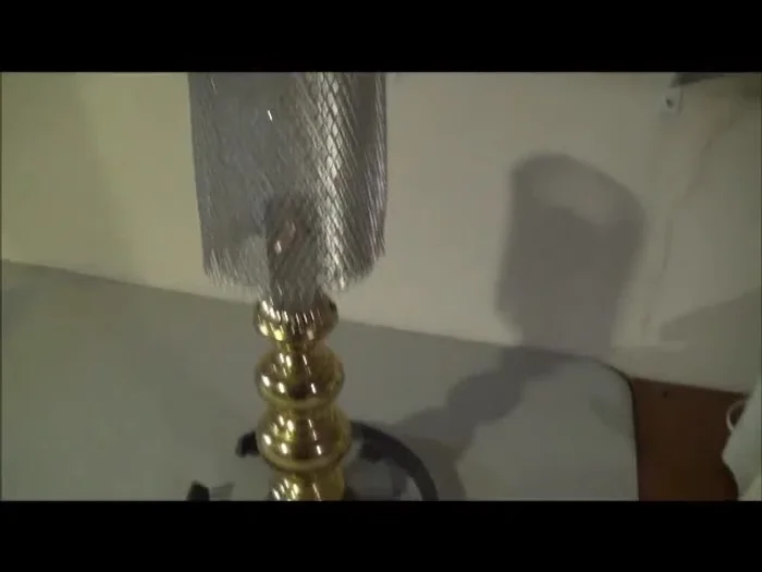 Add the candelabra bulb base: Attach the base of a candelabra-type bulb to the assembled structure.