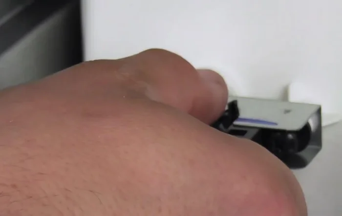 Pull the sensor out and set it aside.