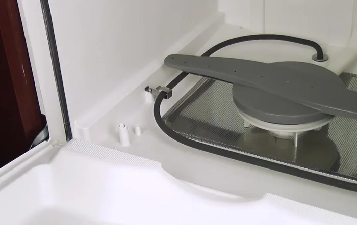 Reinstall the bottom rack and close the door.