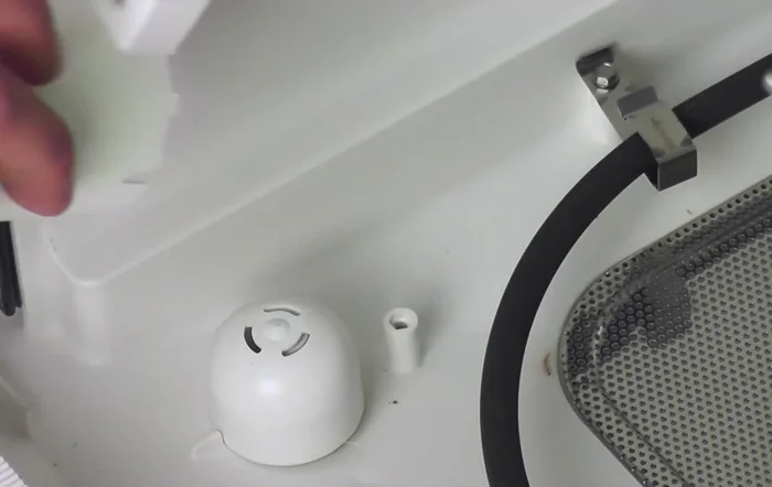 Pull off the cover and set it aside.