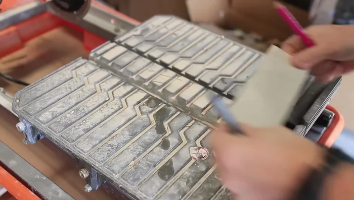 Cut tiles using a wet saw or grinder (explained below).