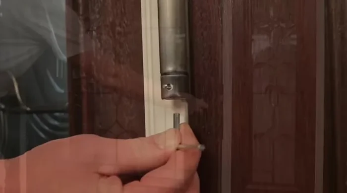 Remove the hex key and test the door's closing action. Repeat steps 2-6 to increase tension if necessary.