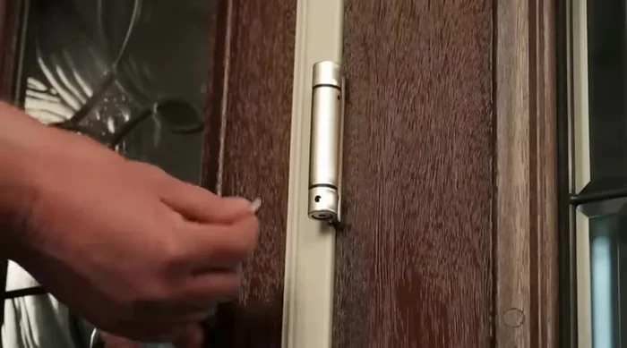 Adjust to minimum tension needed to close and latch the door. Too much tension reduces hinge lifespan.