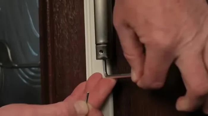 Remove the hex key and test the door's closing action. Repeat steps 2-6 to increase tension if necessary.
