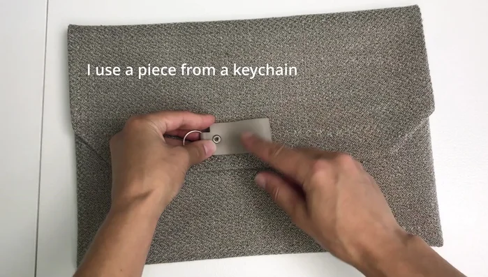 Add optional fabric or leather piece for a label or pull tab.