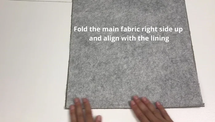 Stitch the top two layers to the lining.