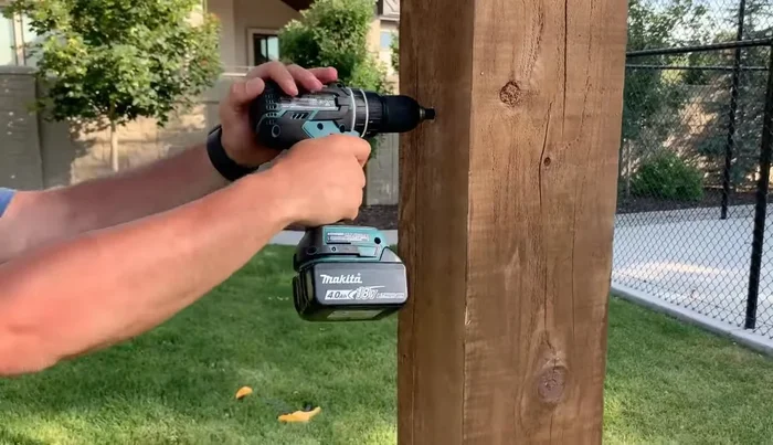 Drill a hole for the lag eye bolt (10-inch) at about 4 feet 8 inches off the ground to hang the hammock.