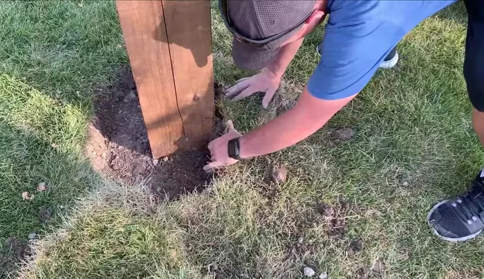 Replace the grass and soil around the posts, water well.