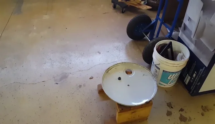 Sand the drum lid and the stopper.