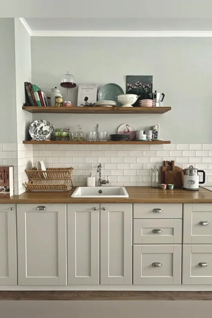 Incorporate symmetry and balance: Use symmetry and balance to create a visually appealing arrangement. For example, place plants on either side of the stove.