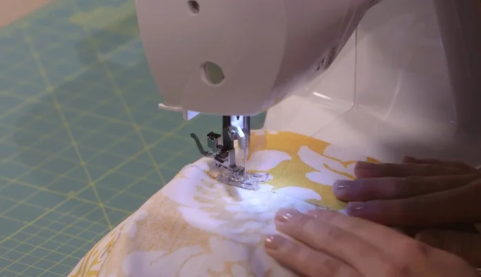 Sew hems: Set your sewing machine to a straight stitch. Sew along all four edges, keeping the needle just to the right of the zigzag stitches. Pivot at corners to create neat mitered corners. Backstitch at the beginning and end.