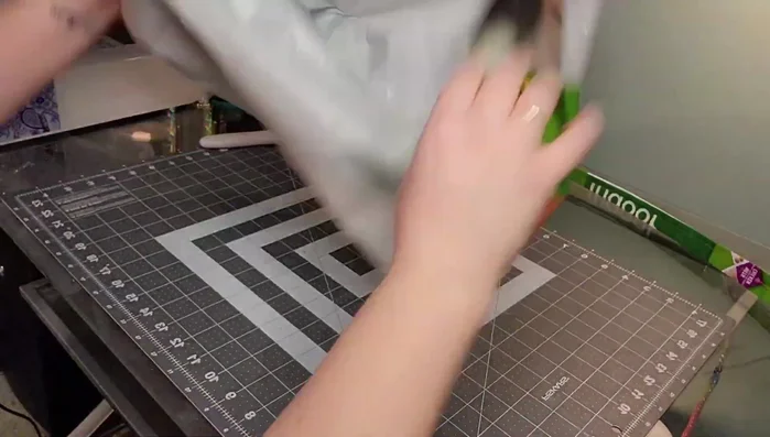 Sew a straight stitch all the way around the top of the bag to secure the folded edge.