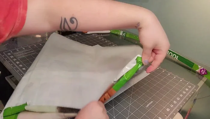 Sew a straight stitch all the way around the top of the bag to secure the folded edge.