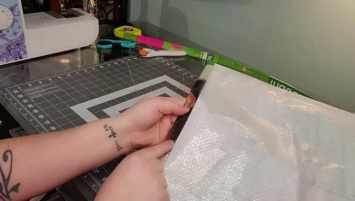 Sew a straight stitch all the way around the top of the bag to secure the folded edge.