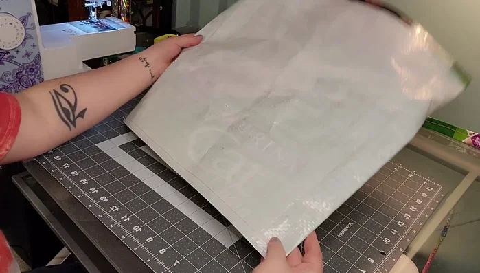 Reinforce the bottom corners by opening up the triangle seam, flattening it, and drawing a line across to sew that section.