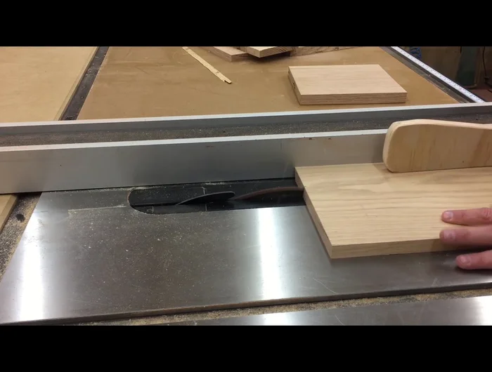 Clamp the lid loosely, ensuring it will fit the box, and add weight for even glue pressure.