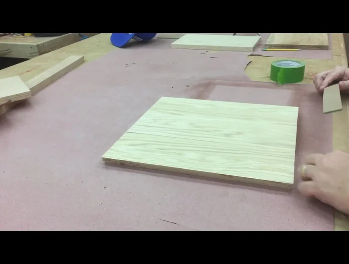 Clamp the lid loosely, ensuring it will fit the box, and add weight for even glue pressure.