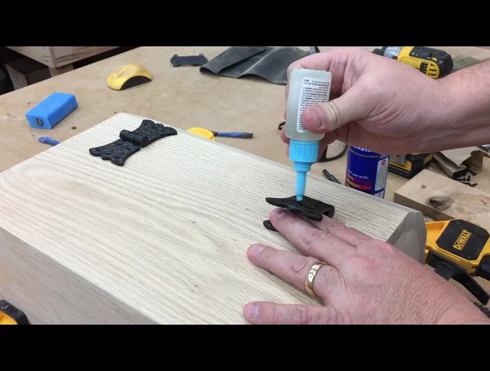 Install handles and lock using a self-centering (vix) bit for accurate screw placement.