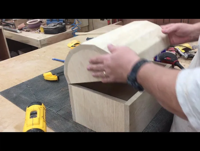 Install handles and lock using a self-centering (vix) bit for accurate screw placement.