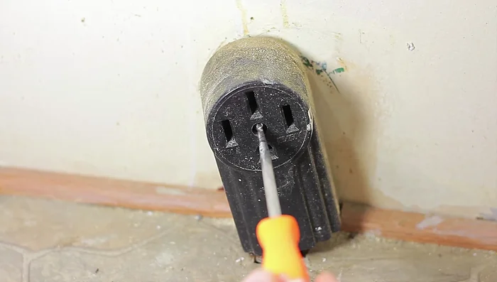 Loosen the screws holding the wires to the outlet (75% is enough).