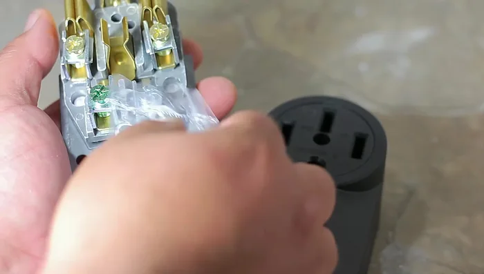 Remove the appropriate knockout on the new outlet (bottom in this case).