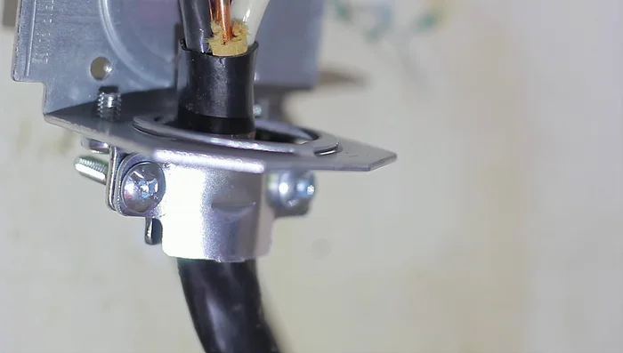 Reinstall the plastic housing and center screw.