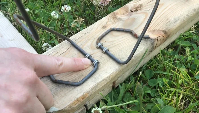 Pry off the metal frame using a flathead screwdriver. Remove staples securing the metal to the wooden frame.