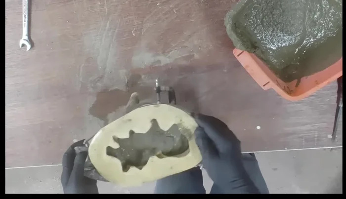 Pour the mixture into the mold until about three-quarters full. Shake the mold vigorously to release air bubbles and fill crevices. Then, continue adding mixture until it reaches the top and shake again.