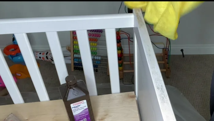 Paint the desk with two to three coats of non-toxic white chalk paint and let it dry completely.