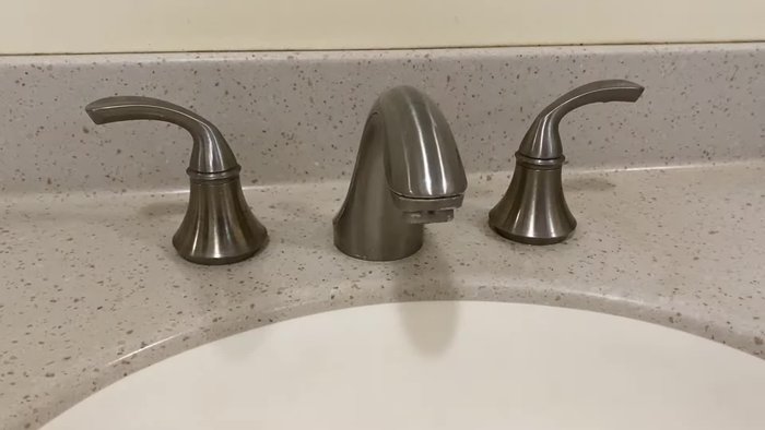 Close the drain or cover with a towel.