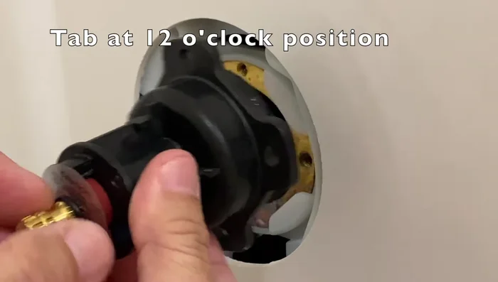 Place the plastic adapter and re-secure with the screws.