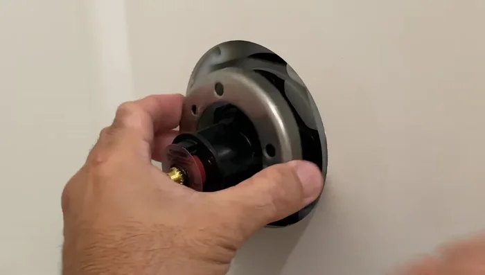 Place the plastic adapter and re-secure with the screws.