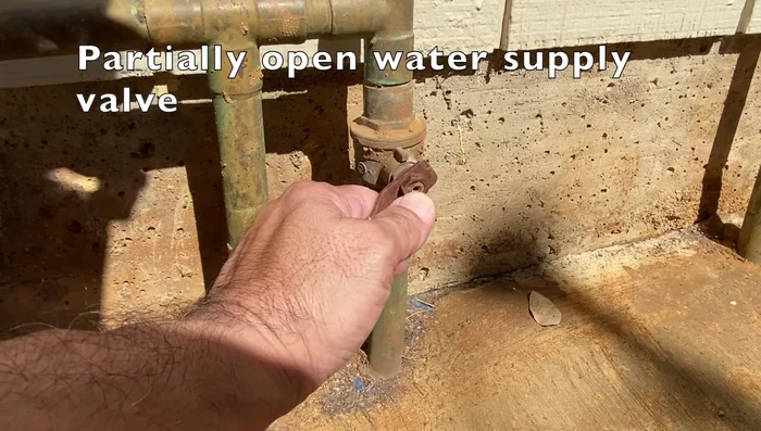 Partially open the water supply valve and open the shower valve to verify water flow. Check for leaks.