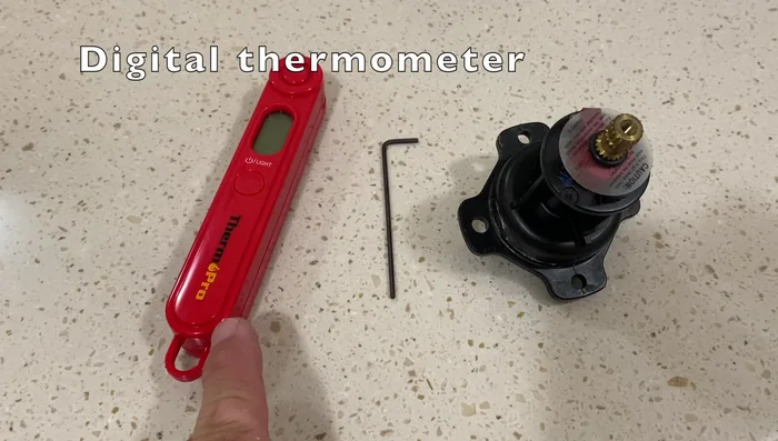 Run hot water and test temperature with thermometer. Adjust to your preference (115 degrees Fahrenheit is suggested).