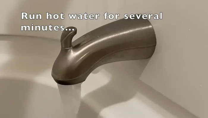 Run hot water and test temperature with thermometer. Adjust to your preference (115 degrees Fahrenheit is suggested).