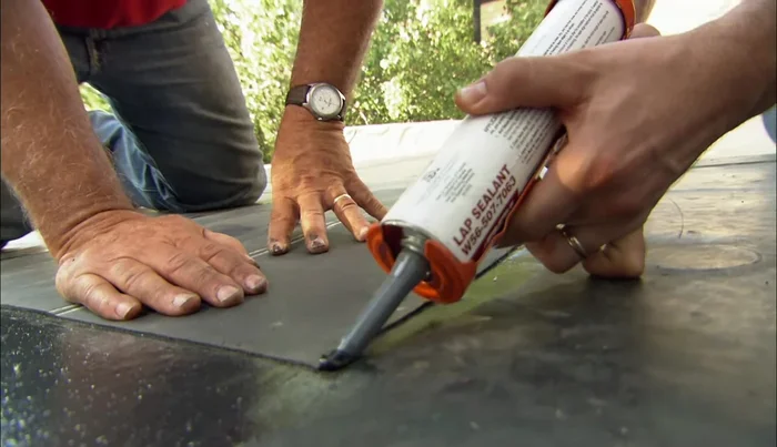 Apply lap sealant around the edges of the patch.