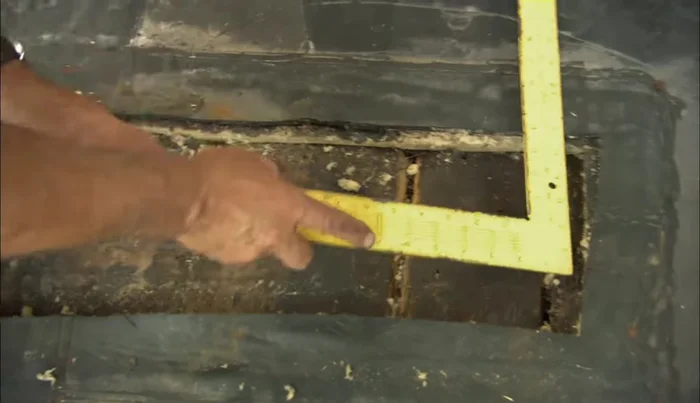 Cut a replacement piece of high-density fiberboard to match the measurements, using another piece of substrate as a guide to avoid cutting through.
