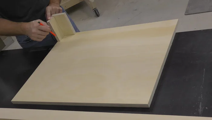 Layout for the cabinet body, using the cabinet bottom and spacer blocks to set the spacing for the finished ends.