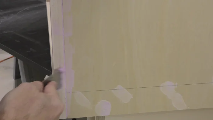 Fill nail holes and seams with spackling, sand smooth.