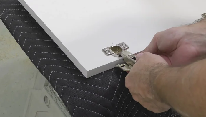 Install drawer fronts and pulls.